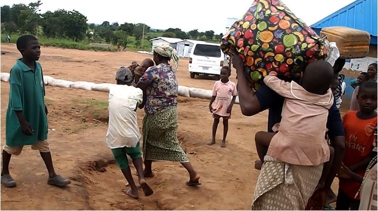 Figure 2: Displaced persons dramatizing how they fled with their belongings (Ukuma 2018)