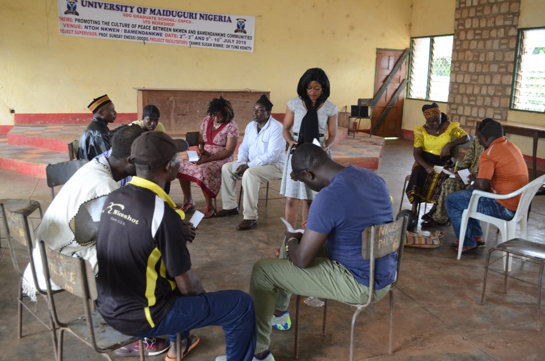 Researcher facilitating workshop in Nkwen community hall